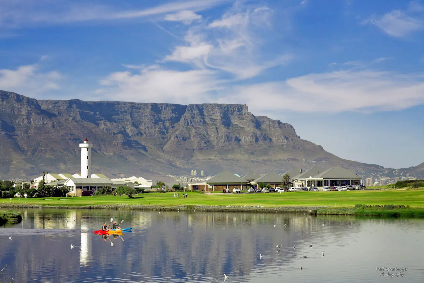 Milnerton lighthouse and clubhouse reflected on the Diep River